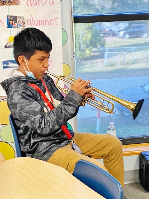 Eduardo playing the trumpet